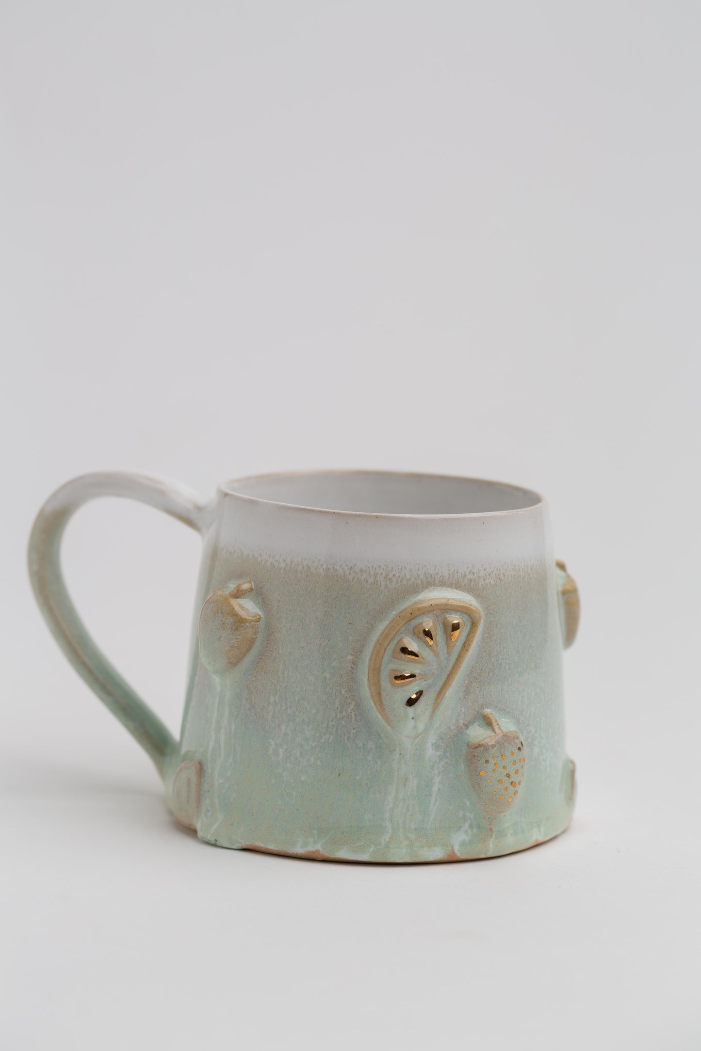 Früchtchen-Tasse mit Echtgold