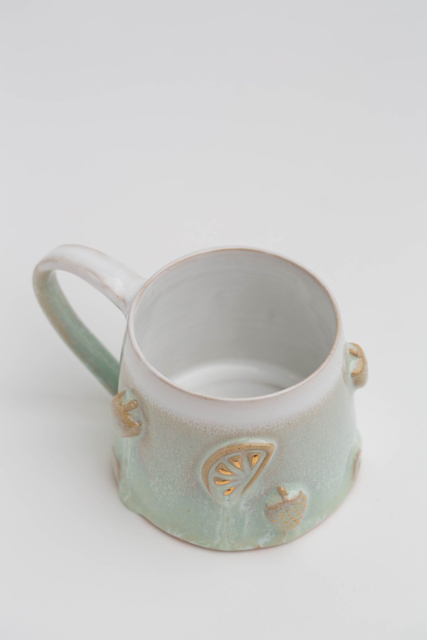 Früchtchen-Tasse mit Echtgold